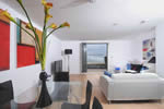 The living area boasts spectacular views over the beach